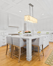Viviana 7 Light 49" Linear Pendant in Polished Nickel in a room setting