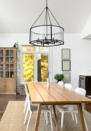 Barrington 8 Light 32" Pendant in Matte Black in a room setting
