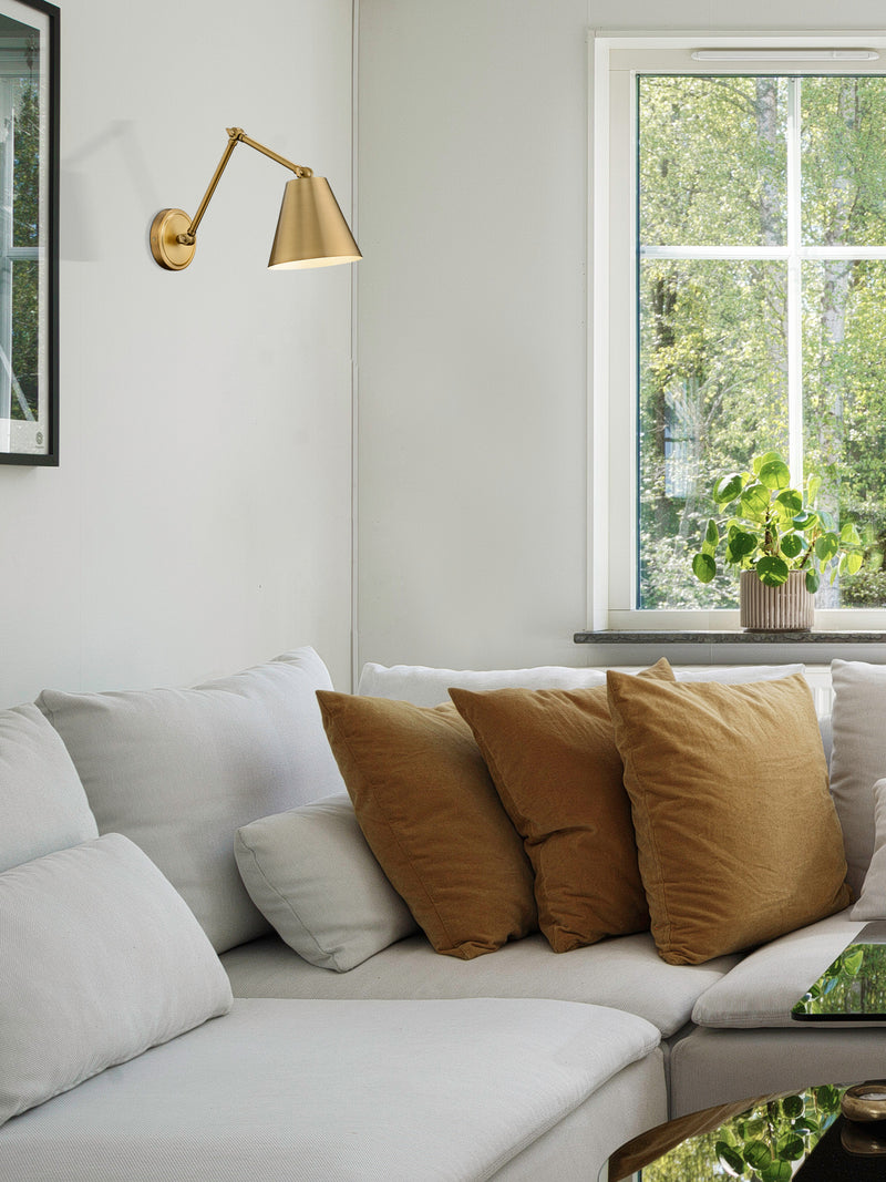 Regent 1 Light Wall Sconce in Rubbed Brass in a room setting