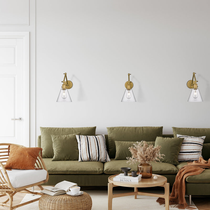 Gayson 1 Light 7.75" Wall Sconce in Rubbed Brass in a room setting