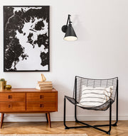Gayson 1 Light 7.5" Wall Sconce in Matte Black in a room setting