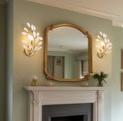 Claudine 1 Light 10" Wall Sconce in Modern Gold in a room setting