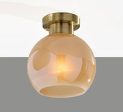 Atticus Flush Mount in Antique Brass