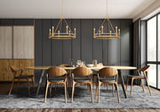 Dennison 6 Light Chandelier in Signature Brass in a room setting