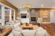 Garroway 9 Light 32" Chandelier in Aged Brass in a room setting