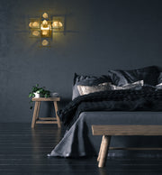 Garroway 2 Light 13.5" Wall Sconce in Aged Brass in a room setting