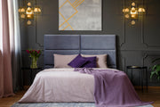 Garroway 2 Light 13.5" Wall Sconce in Aged Brass in a room setting
