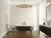 Datus 12 Light 43.5" Chandelier in Rubbed Brass in a room setting