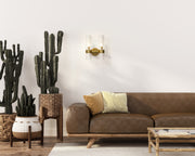 Datus 2 Light 10.25" Wall Sconce in Rubbed Brass in a room setting