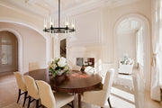 Datus 6 Light 26" Chandelier in Matte Black in a room setting