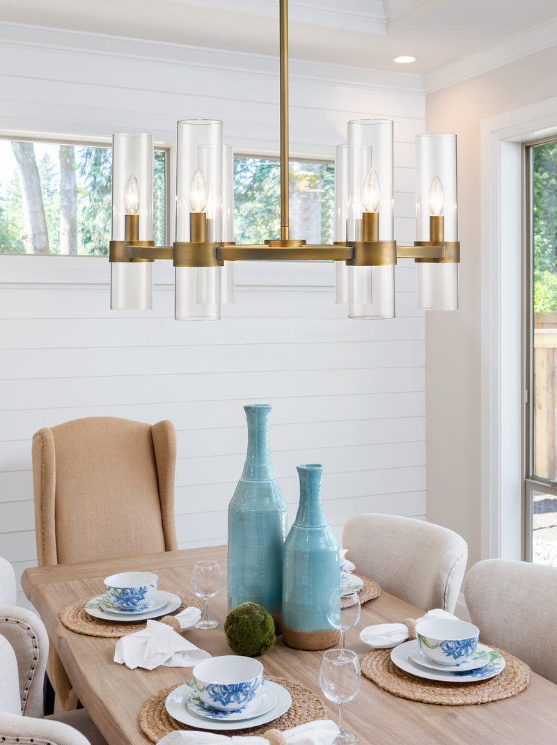 Datus 6 Light 26" Chandelier in Rubbed Brass in a room setting