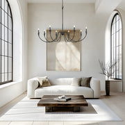 Claudelle 8 Light 65" Chandelier in Matte Black in a room setting