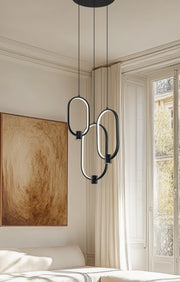 Saros 1 Light 16.25" Pendant in Matte Black in a room setting