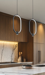 Saros 1 Light 8.75" Pendant in Matte Black in a room setting