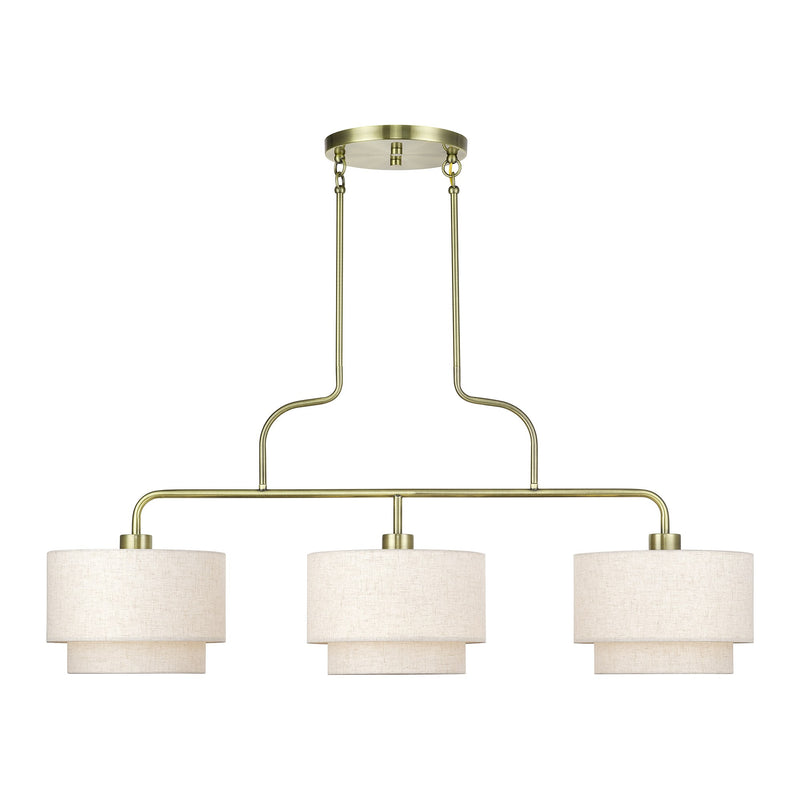 Manorwood 3-Light Extra Large Linear Chandelier with Oatmeal Shades in Antique Brass