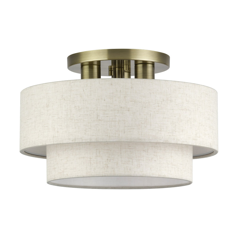 Manorwood 3-Light 15" Semi-Flush Mount with Oatmeal Shade in Antique Brass