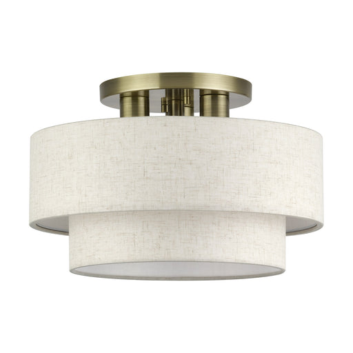 Manorwood 3-Light 15" Semi-Flush Mount with Oatmeal Shade in Antique Brass