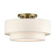 Manorwood 3-Light 18" Semi-Flush Mount with Oatmeal Shade in Antique Brass