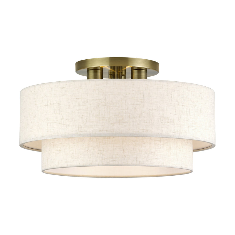 Manorwood 3-Light 18" Semi-Flush Mount with Oatmeal Shade in Antique Brass