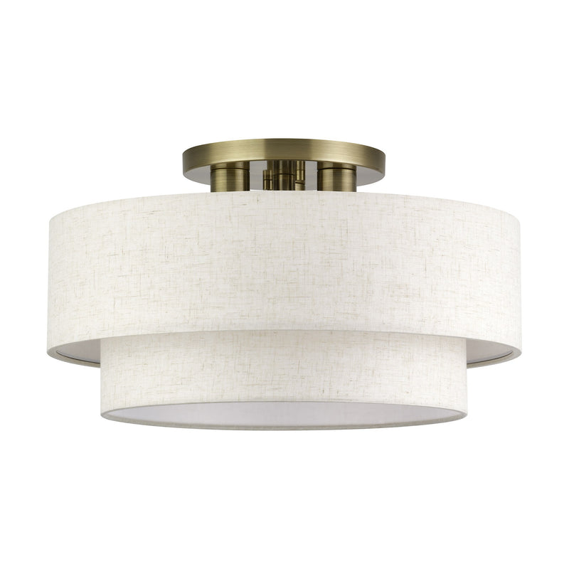 Manorwood 3-Light 18" Semi-Flush Mount with Oatmeal Shade in Antique Brass