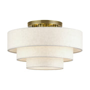 Manorwood 4-Light 21" Semi-Flush Mount with Oatmeal Shade in Antique Brass
