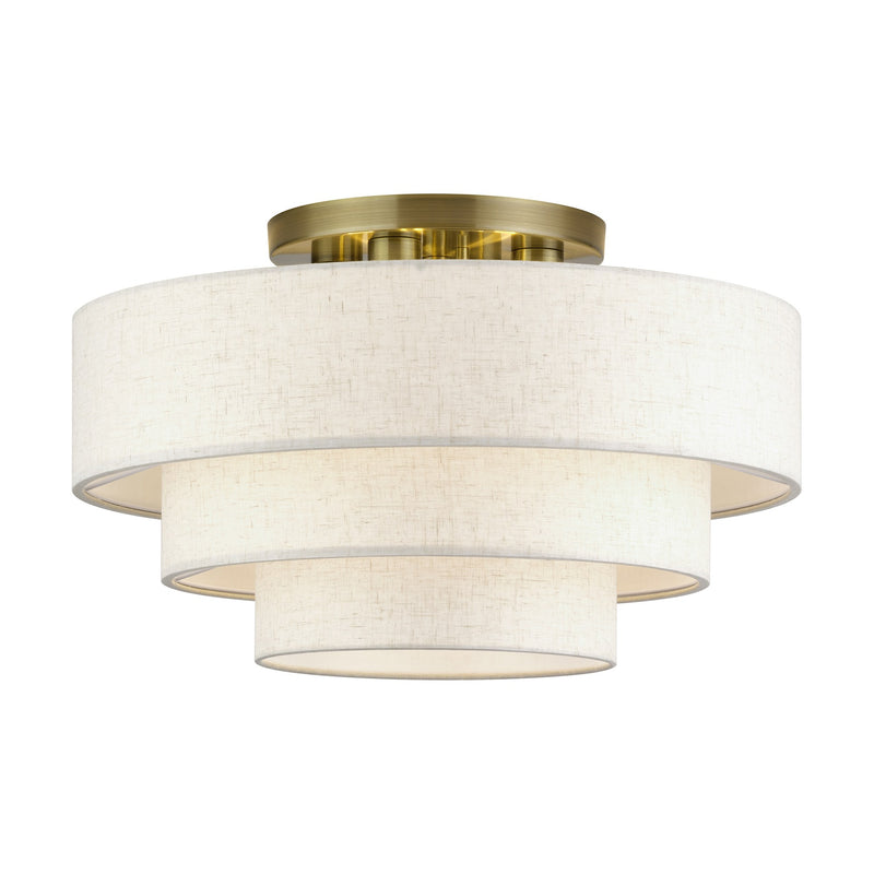 Manorwood 4-Light 21" Semi-Flush Mount with Oatmeal Shade in Antique Brass