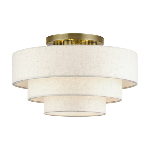 Manorwood 4-Light 21" Semi-Flush Mount with Oatmeal Shade in Antique Brass