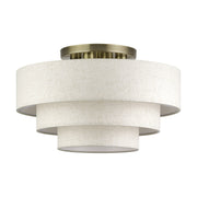 Manorwood 4-Light 21" Semi-Flush Mount with Oatmeal Shade in Antique Brass