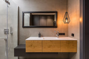 Quintus 1 Light 9.25" Pendant in Plated Bronze in a room setting