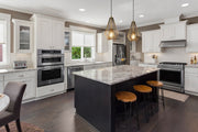 Quintus 1 Light 9.25" Pendant in Rubbed Brass in a room setting