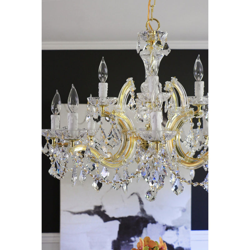 Maria Theresa 12 Light 29" Chandelier in Gold in a room setting