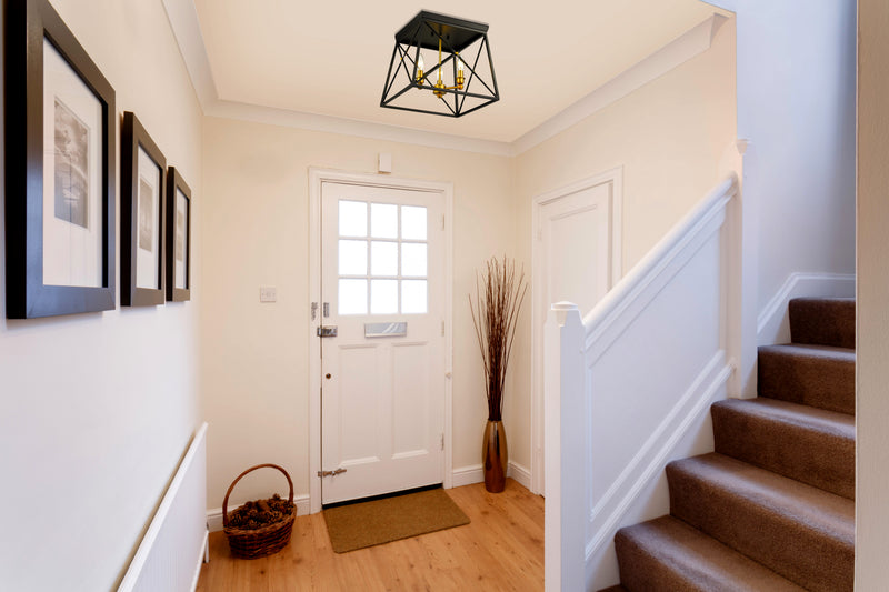 Trestle 3 Light 14" Flush Mount in Matte Black + Olde Brass in a room setting