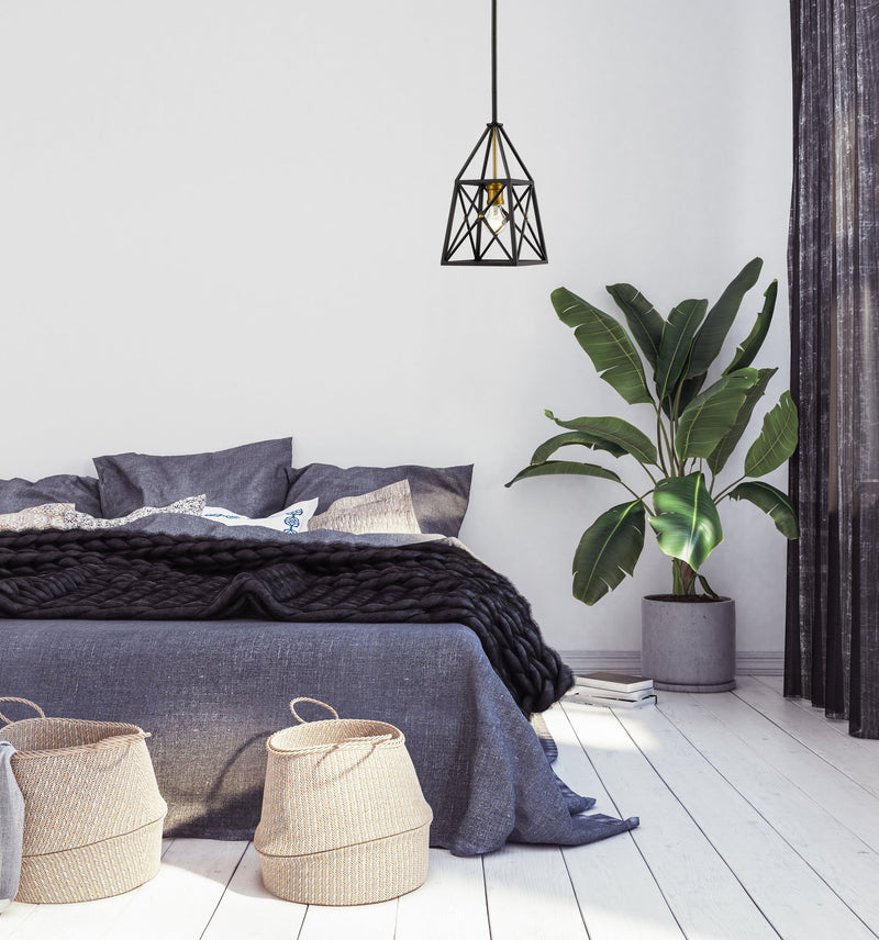 Trestle 1 Light 8" Pendant in Matte Black + Olde Brass in a room setting