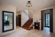 Trestle 3 Light 11" Semi Flush Mount in Matte Black + Olde Brass in a room setting