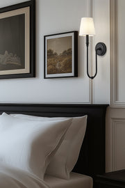Jisele 1 Light 5.75" Wall Sconce in Matte Black in a room setting
