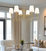 Jisele 6 Light 41.75" Chandelier in Rubbed Brass in a room setting