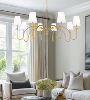 Jisele 8 Light 58.75" Chandelier in Rubbed Brass in a room setting