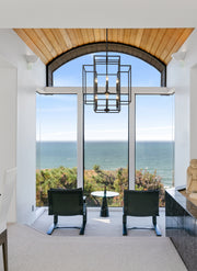 Titania 8 Light 22" Chandelier in Matte Black in a room setting