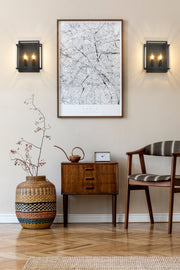 Titania 2 Light 10" Wall Sconce in Matte Black in a room setting
