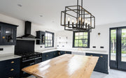 Titania 8 Light 44" Linear Pendant in Matte Black in a room setting
