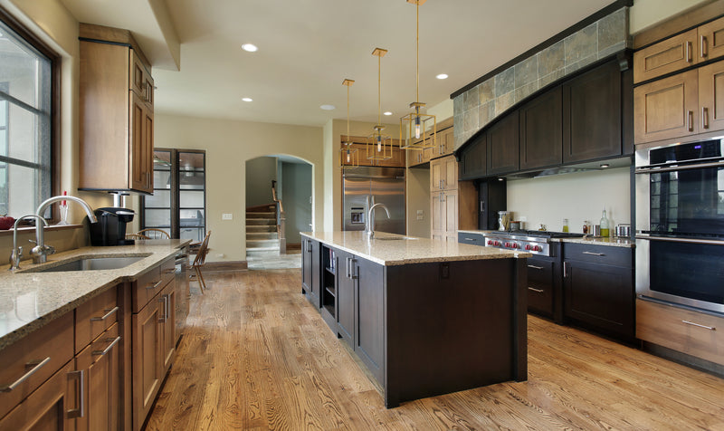Quadra 1 Light 8" Pendant in Olde Brass + Bronze in a room setting