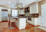 Euclid 10 Light 56" Linear Pendant in Olde Brass + Bronze in a room setting