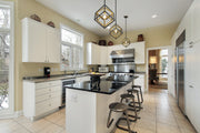 Euclid 1 Light 12" Pendant in Olde Brass + Bronze in a room setting