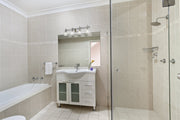 Bohin 4 Light 32" Vanity in Brushed Nickel in a room setting