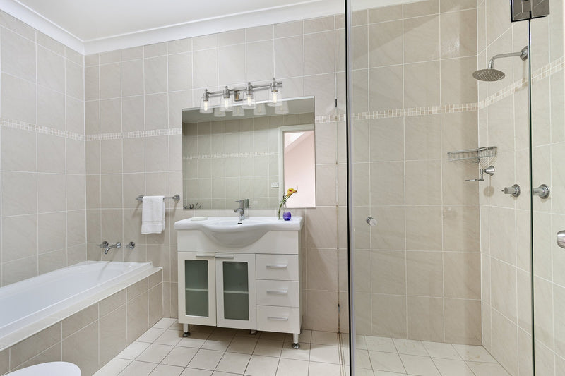Bohin 4 Light 32" Vanity in Brushed Nickel in a room setting