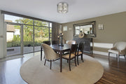 Cronise 2 Light Wall Sconce in Chrome in a room setting