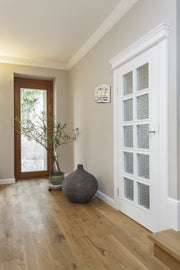 Cronise 2 Light Wall Sconce in Chrome in a room setting