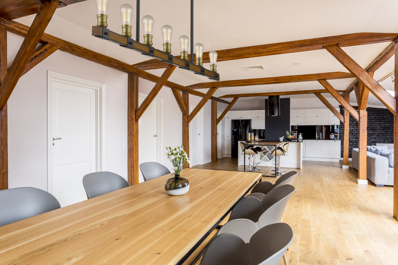 Kirkland 7 Light 44" Linear Pendant in Rustic Mahogany in a room setting