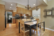 Kirkland 3 Light 14" Chandelier in Rustic Mahogany in a room setting