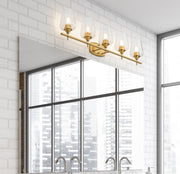Joliet 5 Light Vanity in Burnished Brass in a room setting